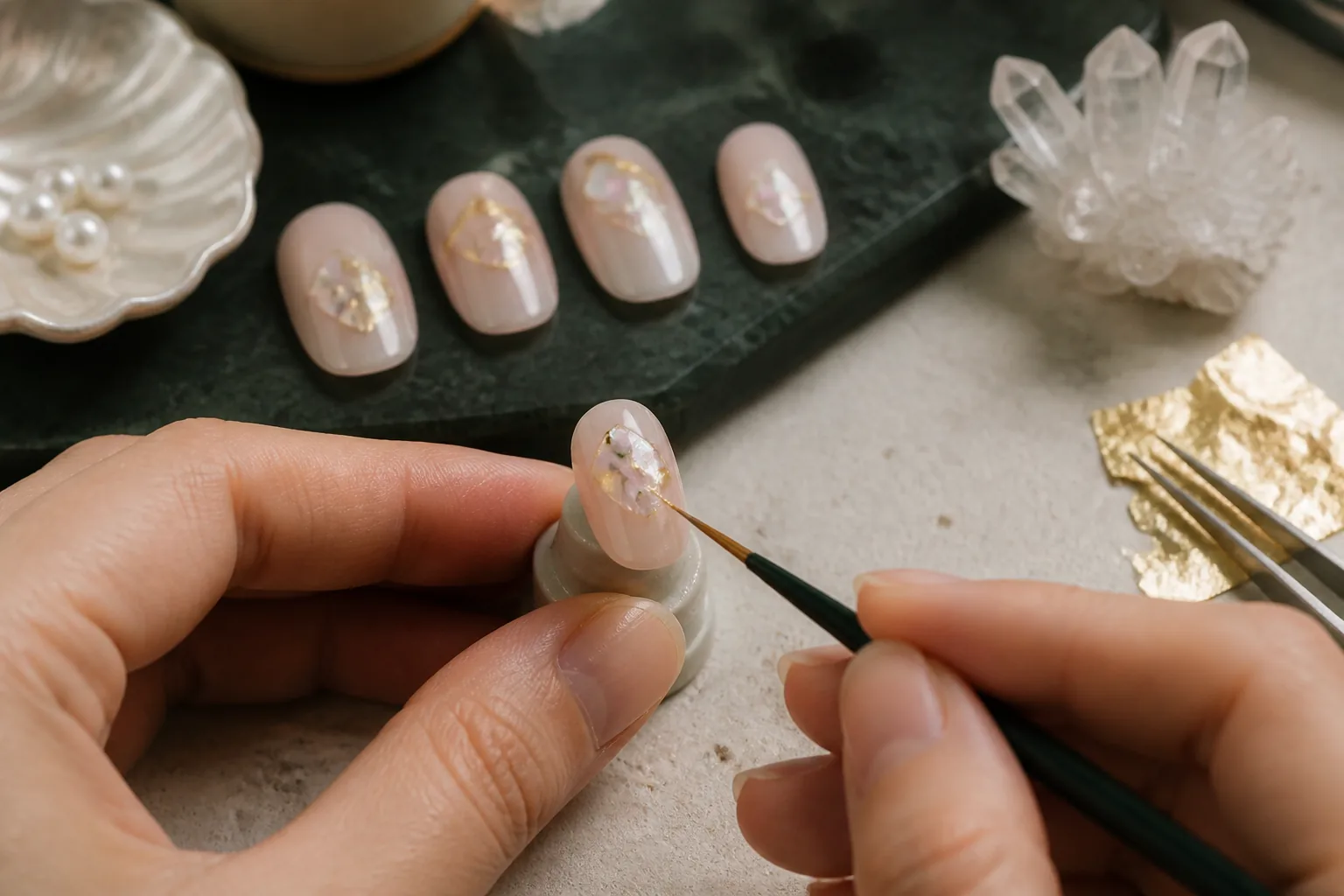 Mirelle nail artist hand-finishing a short oval commission study